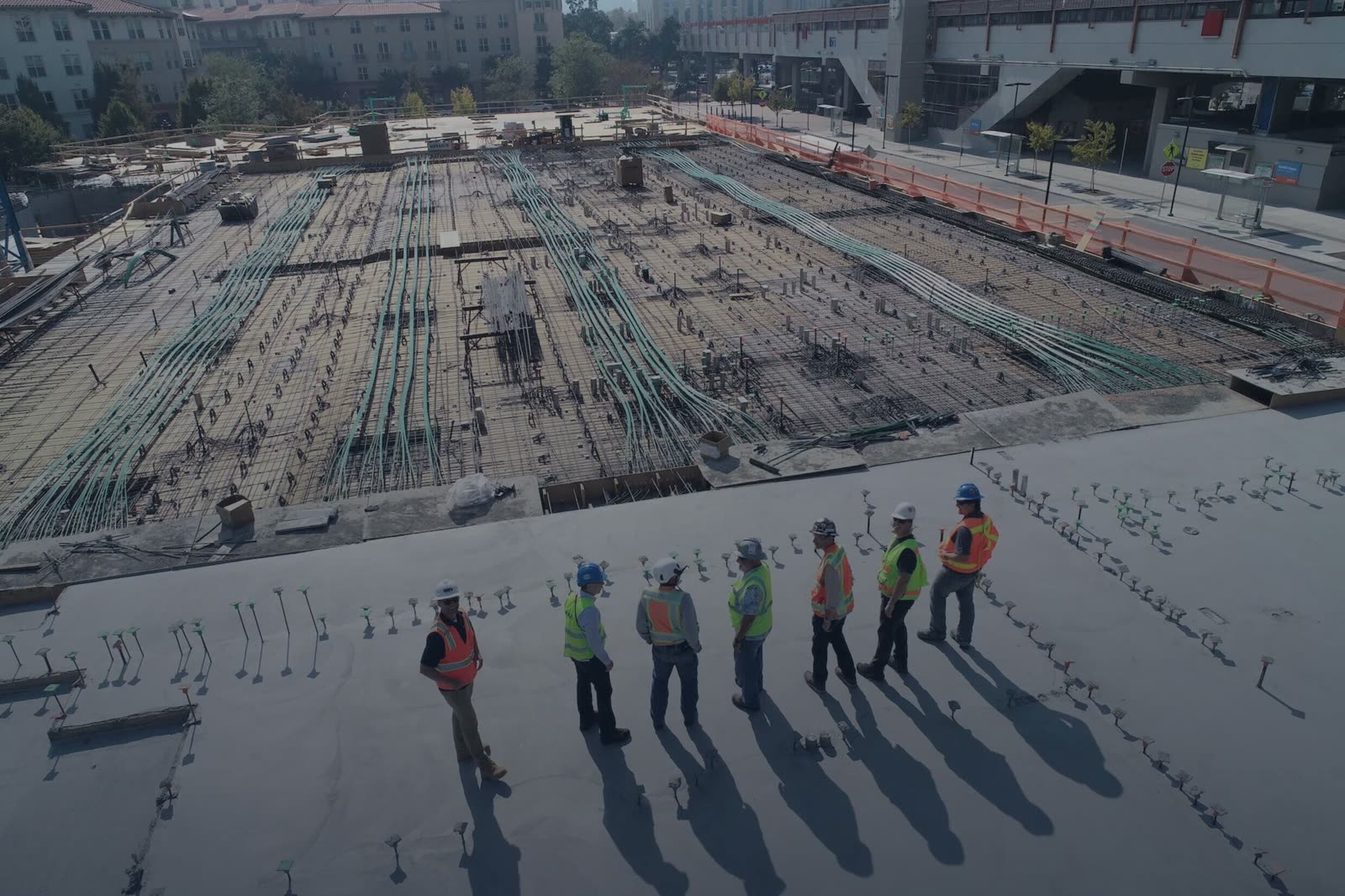 A BAWE site team on a reinforced concrete slab during a commercial build
