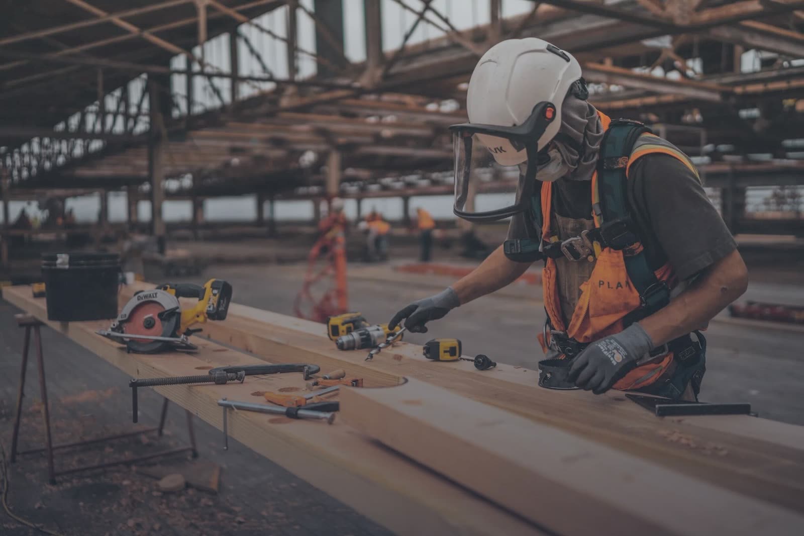 A BAWE tradesman setting out timber shuttering ahead of a concrete pour