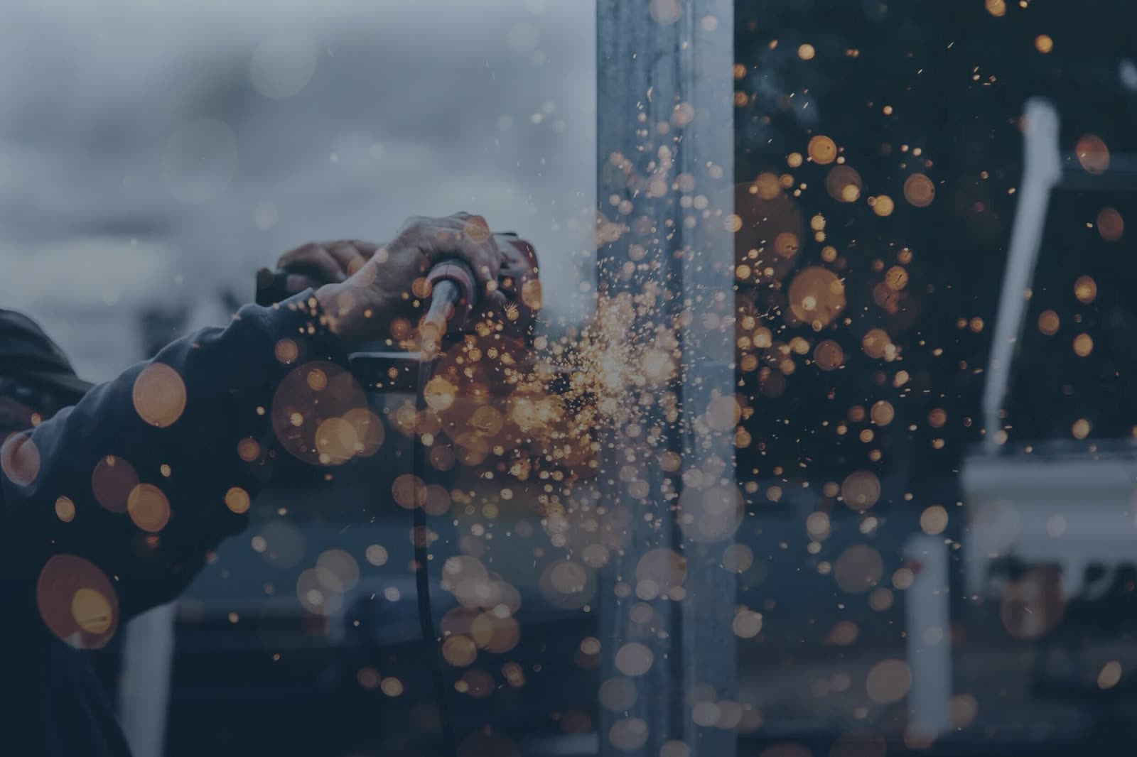 Welding sparks flying during a mining infrastructure installation
