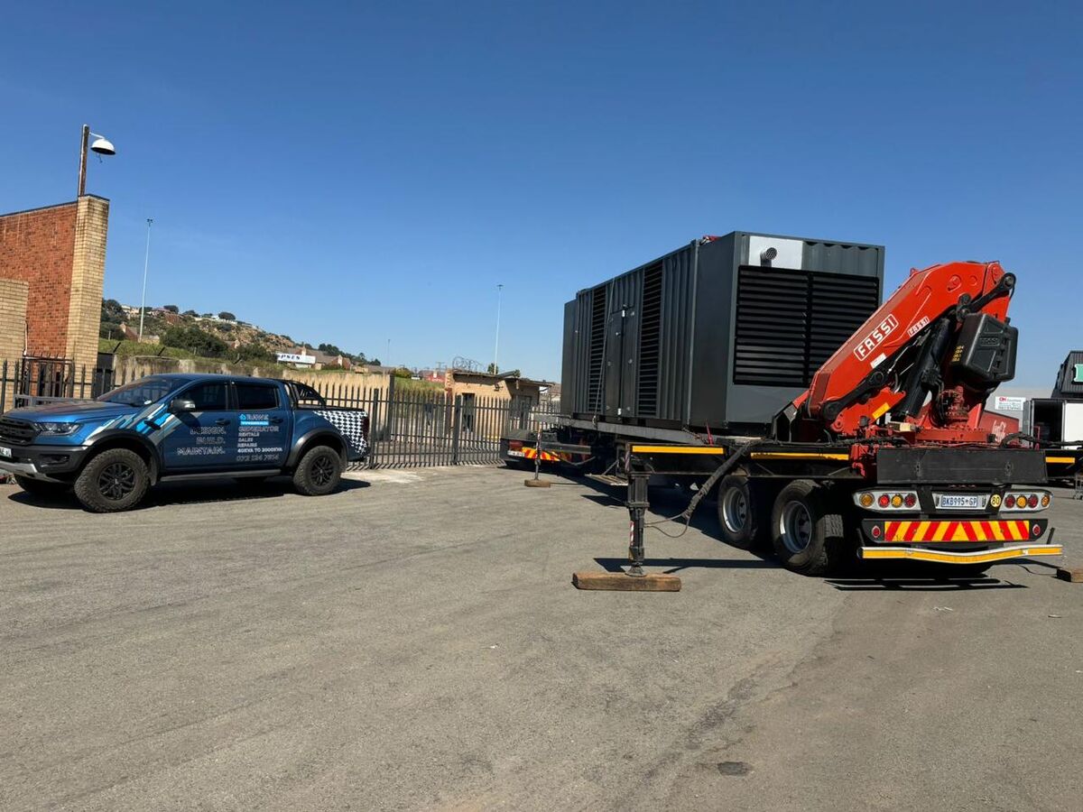 Generator unit on a flatbed being delivered to a Checkers Hyper site